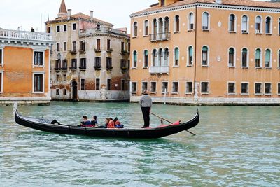 People on boat in river