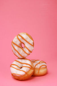 Directly above shot of fruits against pink background