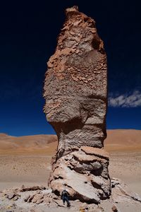 Close-up of rock formations in desert against blue sky