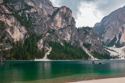 Scenic view of sea and mountains against sky