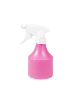 Close-up of pink bottle against white background