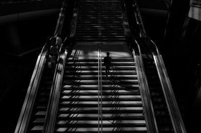 Low angle view of man on escalator