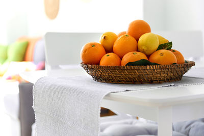 Close-up of fruits in basket on table