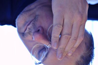 Close-up portrait of boy with hands