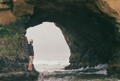 Woman standing on rock formation