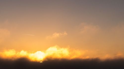 Scenic view of dramatic sky during sunset