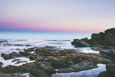 Scenic view of sea against sky at sunset