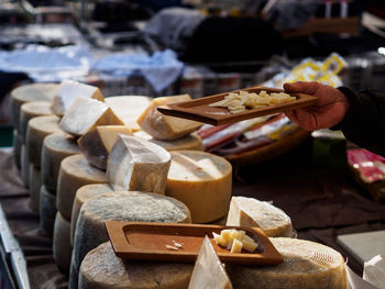 Person preparing food in market stall