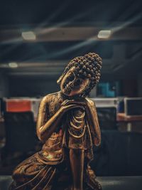 Close-up of figurine sculpture on table