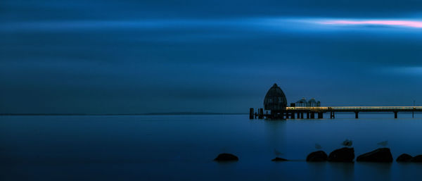 Scenic view of sea against sky at night