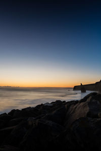 Scenic view of sea against sky during sunset