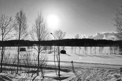 Scenic view of frozen lake against sky during winter