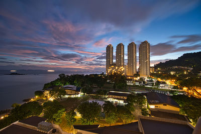 High angle view of illuminated buildings against sky during sunset