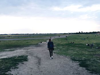 Rear view of man standing on field