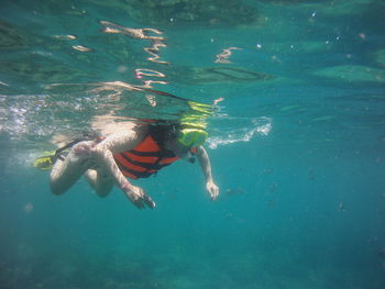 Woman swimming in sea