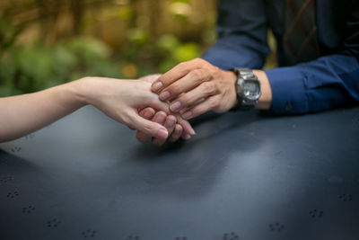 Close-up of hand touching hands