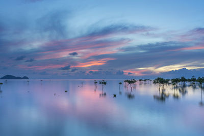 Scenic view of sea against sky at sunset