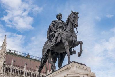 Low angle view of statue against sky