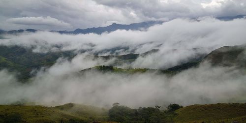 Scenic view of clouds over mountains