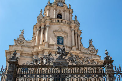 The gate to enter the cathedral of ragusa ibla, in its top st. george with his horse.