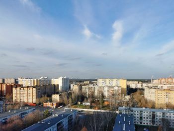 High angle view of buildings in city against sky