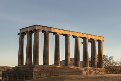 Low angle view of old ruins against clear sky