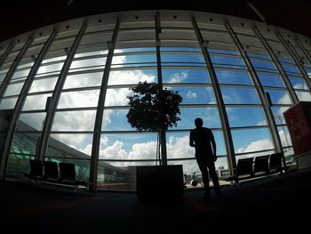 Low angle view of woman against clear sky