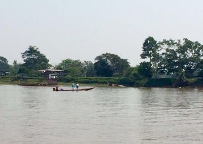Tourists on boat in river