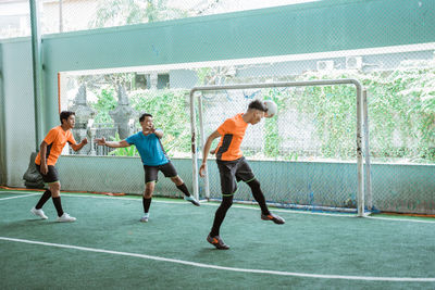 Soccer player playing soccer on field