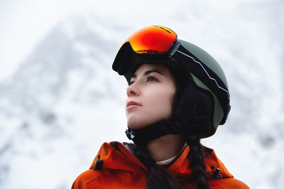 Low angle view of woman standing against sky