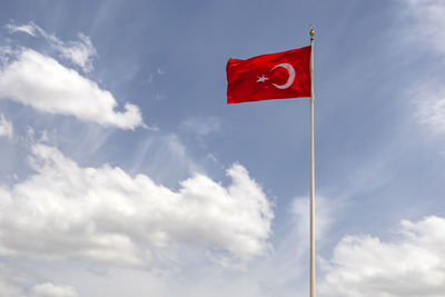 Low angle view of flag against sky