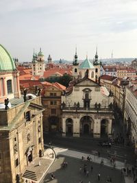 Tourists in front of historic churches in prague