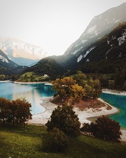 Scenic view of lake and mountains against sky