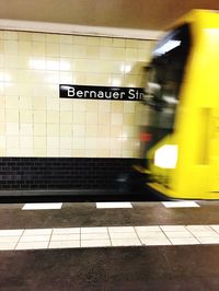 Train moving on railroad station platform