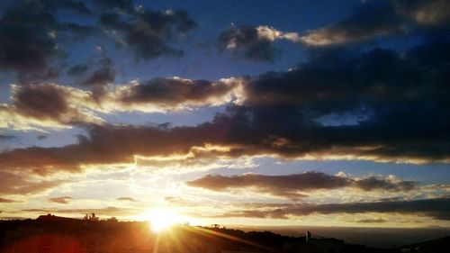 Sun shining through clouds