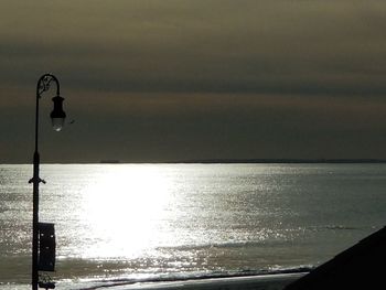 Scenic view of sea against sky at sunset