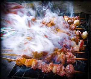 Close-up of meat on barbecue grill