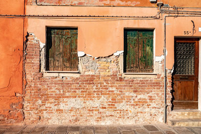 Low angle view of window on old building