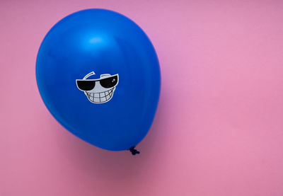 Close-up of balloons against blue background
