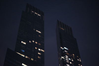 Low angle view of modern building at night