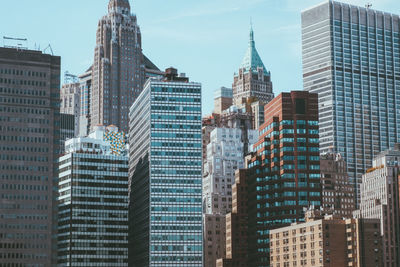 Skyscrapers in city against sky