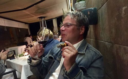 Portrait of man holding ice cream in restaurant