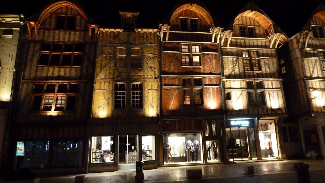 LOW ANGLE VIEW OF ILLUMINATED BUILDING