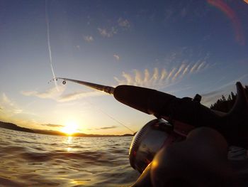 Low angle view of fishing rod against clear sky