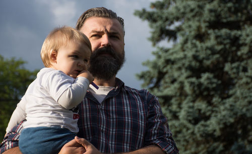 Father and son with daughter