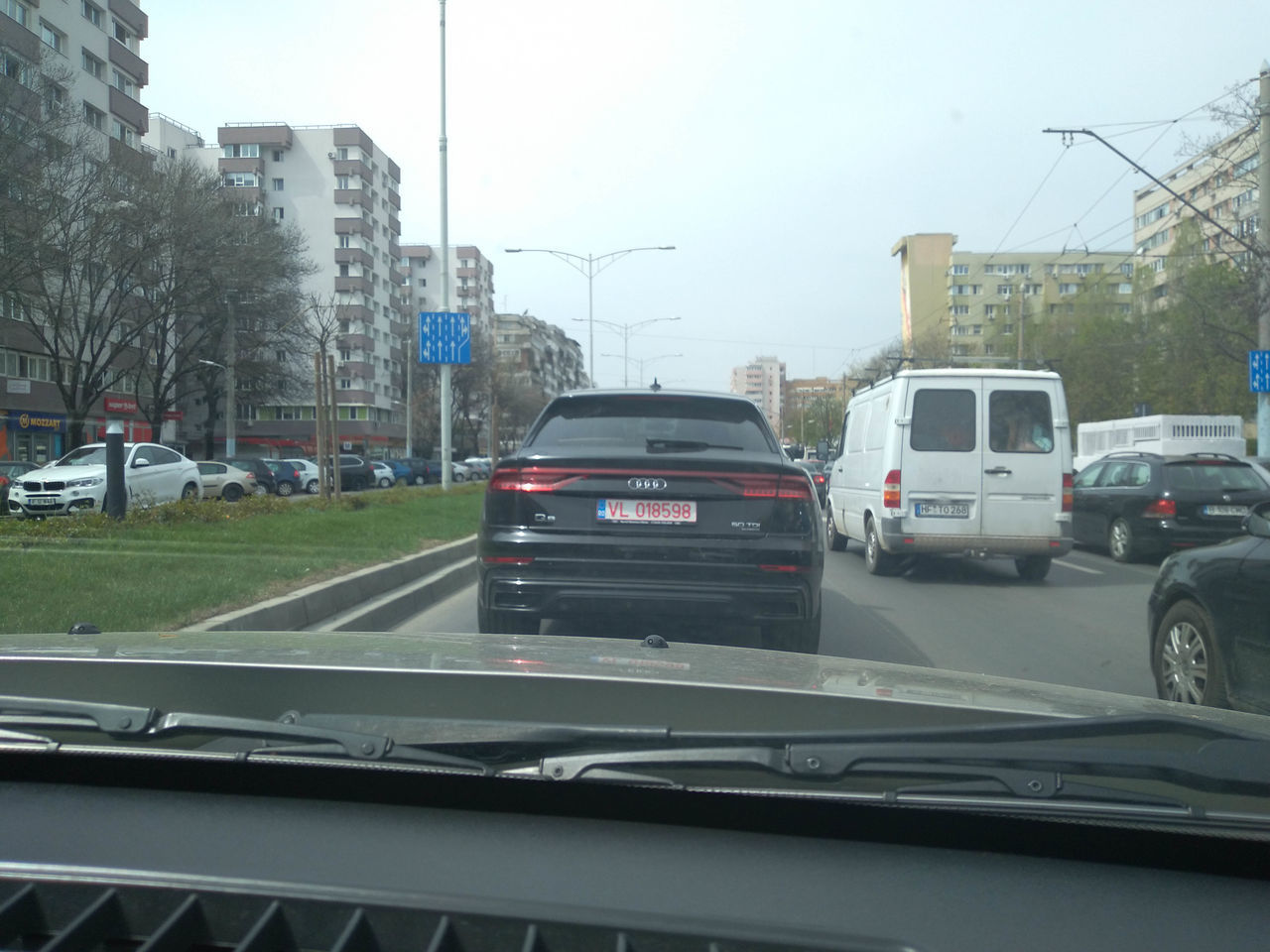 VEHICLES ON ROAD IN CITY