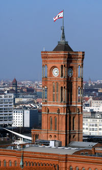 View of buildings in city against clear sky