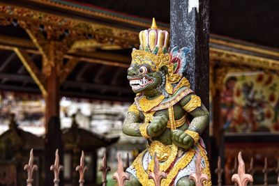 Sculpture of buddha statue outside temple