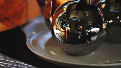 Close-up of beer glass on table at home