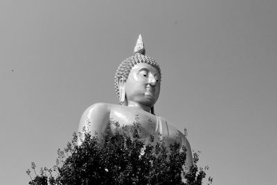 Low angle view of statue against sky